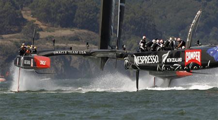 Emirates Team New Zealand (R) takes an early lead against Oracle Team USA during Race 7 of the 34th America's Cup yacht sailing race in San Francisco, California September 12, 2013. REUTERS/Robert Galbraith