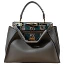 <p><em>Fendi bag</em><em>, </em><span>£4,040, <a rel="nofollow noopener" href="https://www.24sevres.com/en-gb/peekaboo-fendi_BCNN5?color=grey-multicolor-soft-gold-finishing" target="_blank" data-ylk="slk:24Sévres;elm:context_link;itc:0;sec:content-canvas" class="link ">24Sévres</a></span></p>