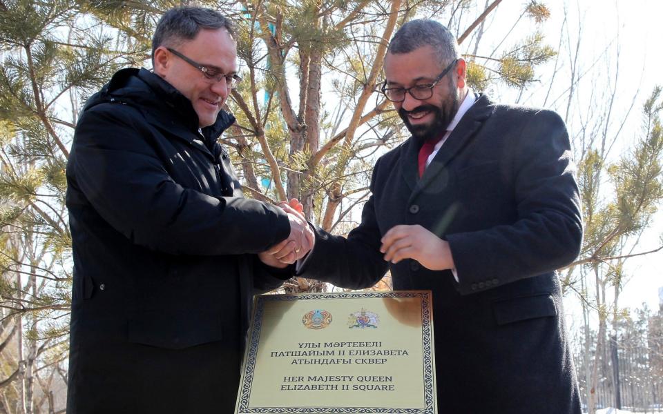 British Foreign Secretary James Cleverly, right, and Kazakhstan's Deputy Foreign Minister Roman Vassilenko attend an opening ceremony of the square in the Central Park of Astana named after Queen Elizabeth II after their talks in Astana, Kazakhstan, Saturday, March 18, 2023. (AP Photo) - AP