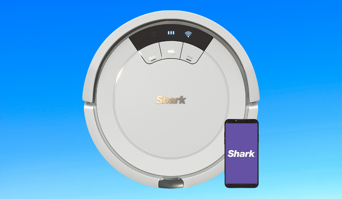 A white Shark robot vacuum with an iPhone reading 