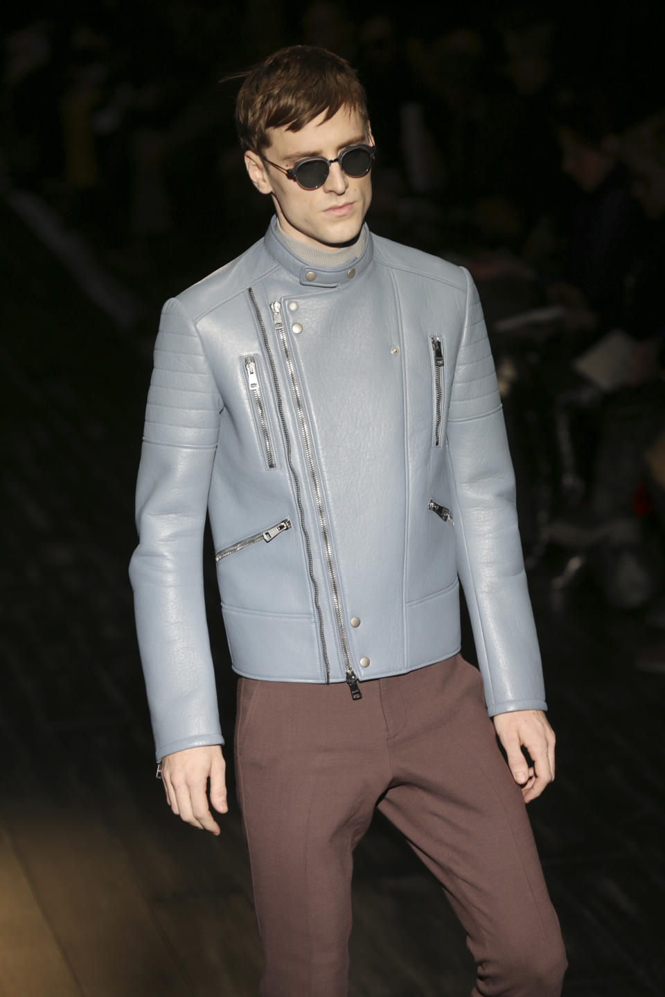 A model wears a creation for Gucci men's Fall-Winter 2014 collection, part of the Milan Fashion Week, unveiled in Milan, Italy, Monday, Jan.13, 2014. (AP Photo/Luca Bruno)