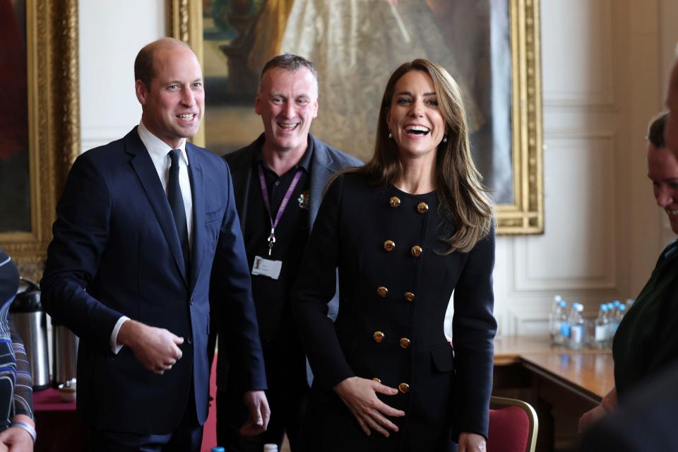 Britain's Prince William and Kate, Princess of Wales, meet volunteers and operational staff who were involved in facilitating the Committal Service for Queen Elizabeth II at St George's Chapel, at Windsor Guildhall, Berkshire, Thursday, Sept. 22, 2022.