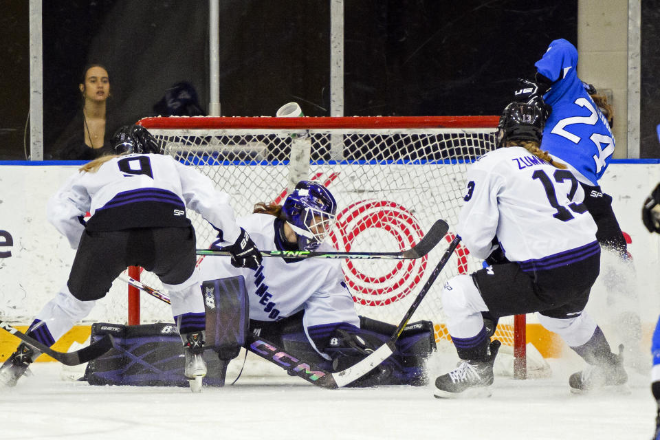 Toronto forward Natalie Spooner (24) scores on Minnesota goaltender Nicole Hensley (29) during the first period of a PWHL hockey game in Toronto, Ontario, Saturday, Feb. 3, 2024. (Christopher Katsarov/The Canadian Press via AP)