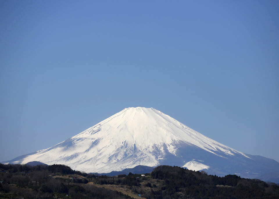 Japan's Mount Fuji is seen covered with snow from Nakai town, Kanagawa prefecture, Japan, March 1, 2016. REUTERS/Issei Kato 