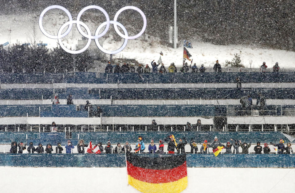 <p>Fans watch in the snow during the venue ceremony for the Men’s Nordic Combined Team Cross-Country Skiing event at the 2018 Winter Olympics in PyeongChang, South Korea, Feb. 22, 2018.<br> (AP Photo/Matthias Schrader) </p>