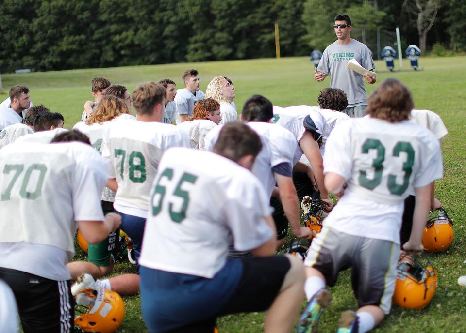 Coach Matt Doyle talks with his players during a South Shore Tech football practice at Sylvester Field in Hanover on Tuesday, Aug. 24, 2021.