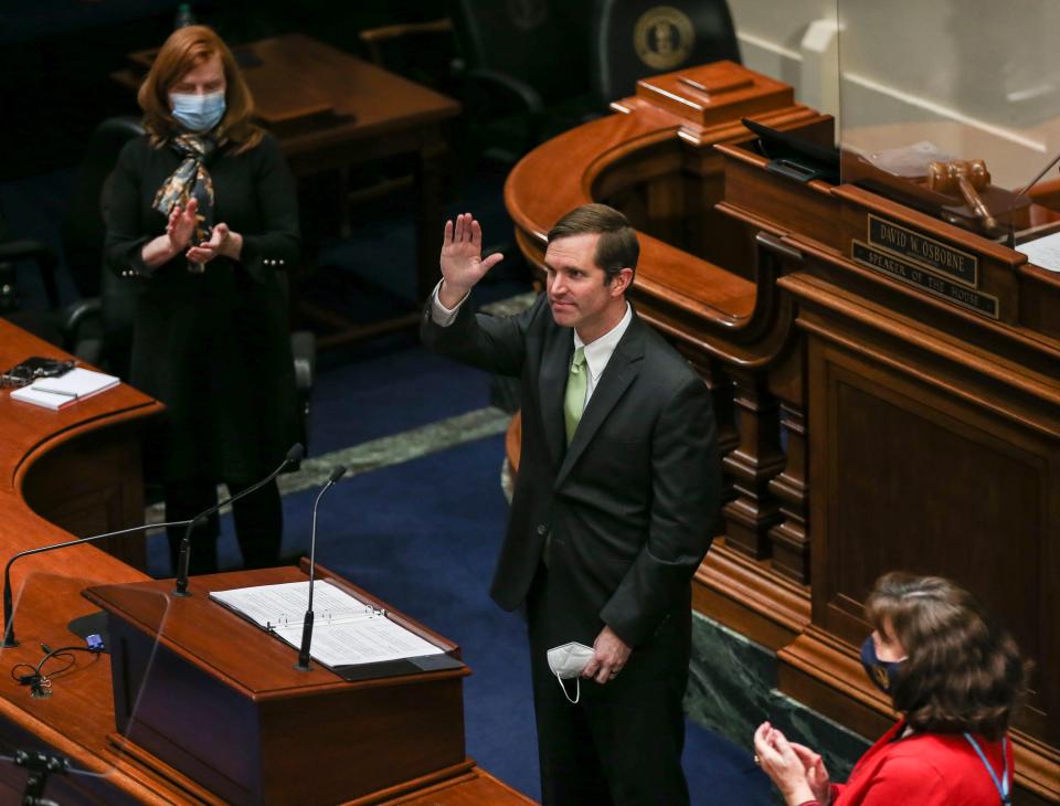 Gov. Andy Beshear acknowledges the applause after he finished his 2022 state budget address at the Capitol in Frankfort. Jan. 13, 2022