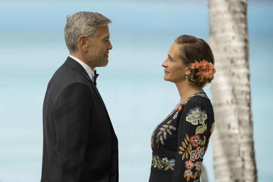 This image released by Universal Pictures shows George Clooney, left, and Julia Roberts in "Ticket to Paradise." (Vince Valitutti/Universal Pictures via AP)