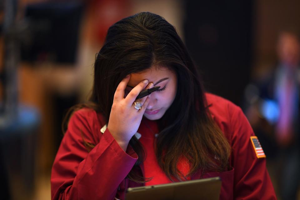 A trader reacts during the opening bell at the New York Stock Exchange (NYSE) on February 28, 2020 at Wall Street in New York City. - Losses on Wall Street deepened following a bruising open, as global markets were poised to conclude their worst week since 2008 with another rout. (Photo by Johannes EISELE / AFP) (Photo by JOHANNES EISELE/AFP via Getty Images)