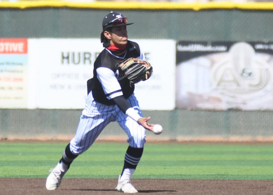 Canyon Randall's Kole Dudding flips to second base against Lubbock-Cooper in a FirstBank Classic tournament game Saturday, March 12, 2022, at First United Park in Woodrow.