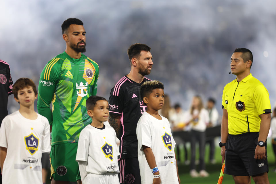 CARSON, CALIFORNIA - FEBRUARY 25: Drake Callender #1 and Lionel Messi #10 of Inter Miami CF and Saint West (R) look on prior to a game against the Los Angeles Galaxy at Dignity Health Sports Park on February 25, 2024 in Carson, California. (Photo by Sean M. Haffey/Getty Images)