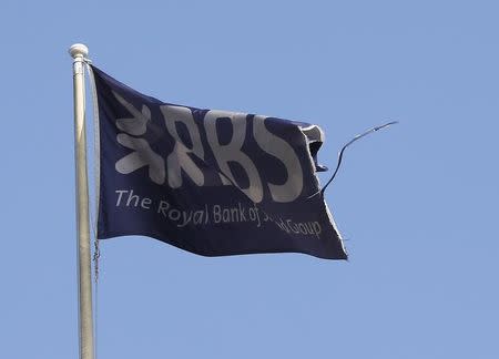 A flag flies above the head office of the Royal Bank of Scotland (RBS) in St Andrew Square in Edinburgh, Scotland September 11, 2014. REUTERS/Russell Cheyne/File Photo