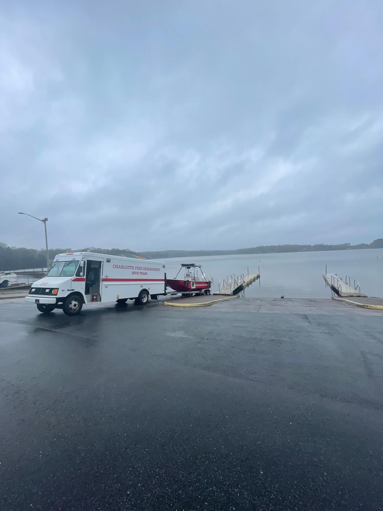 A Charlotte dive team boat sits at the edge of Moss Lake Friday afternoon.