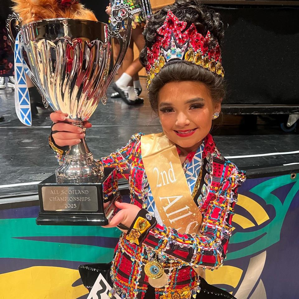 Erin Mayo shows off her trophy after placing second in her age group at the All Scotland competition in October.