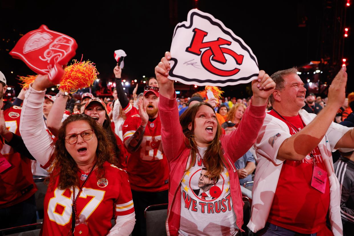 Kansas City Chiefs fans react to their teams selection in the third round of the 2023 NFL draft at Union Station on April 28, 2023 in Kansas City, Missouri.