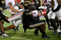Georgia running back Kendall Milton (2) is tackled by Missouri defensive lineman DJ Coleman (7) during the first half of an NCAA college football game Saturday, Oct. 1, 2022, in Columbia, Mo. (AP Photo/L.G. Patterson)