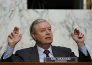 Senate Judiciary Committee Chairman Lindsey Graham, R-S.C., questions Supreme Court nominee Amy Coney Barrett during the second day of her confirmation hearing before the Senate Judiciary Committee on Capitol Hill in Washington, Tuesday, Oct. 13, 2020. (Drew Angerer/Pool via AP)