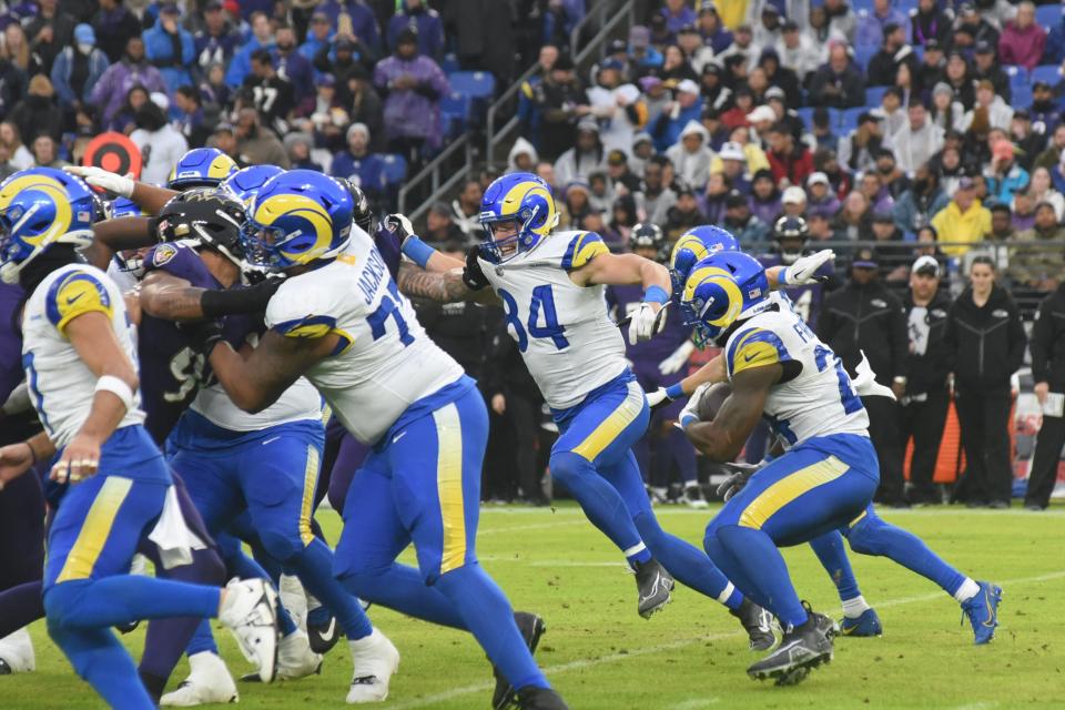 Los Angeles Rams tight end Hunter Long, a 2016 graduate of Exeter High School, and teammates block for running back Royce Freeman during Sunday's NFL game against Baltimore at M&T Bank Stadium. Long was injured in the first half and didn't return. It was learned Monday that Long tore the MCL in his left knee and is lost for the season, his first with the Rams.