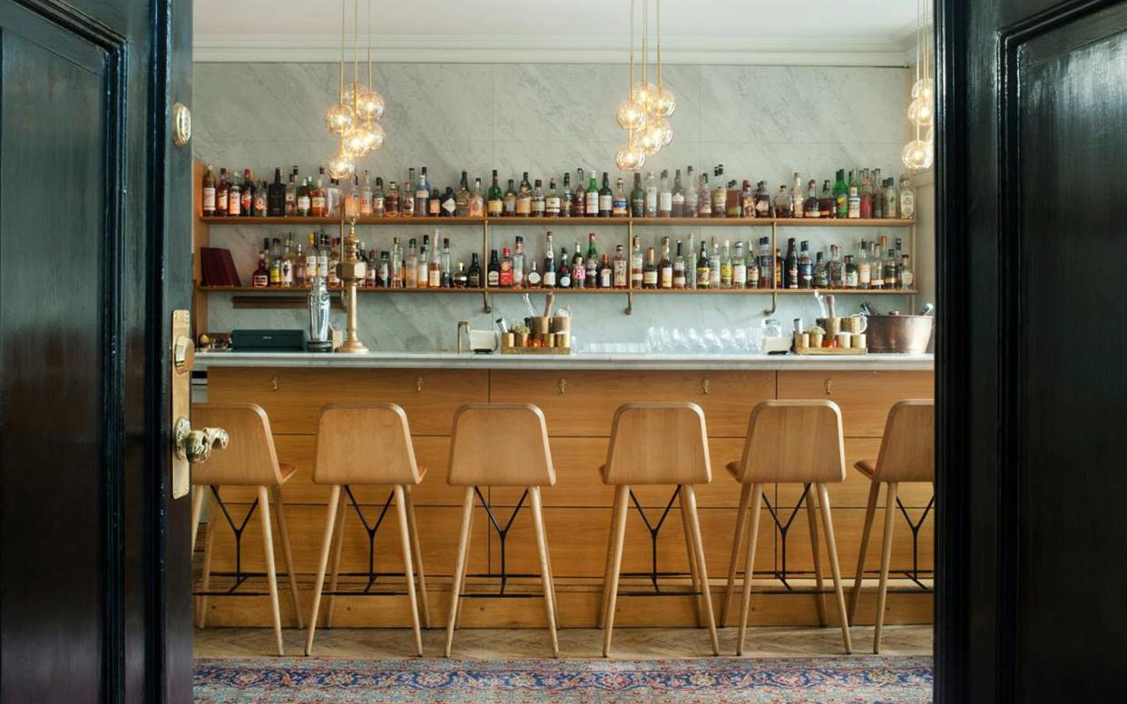 Pull up a tall chair and get to know the well-stocked marble bar at Ruby