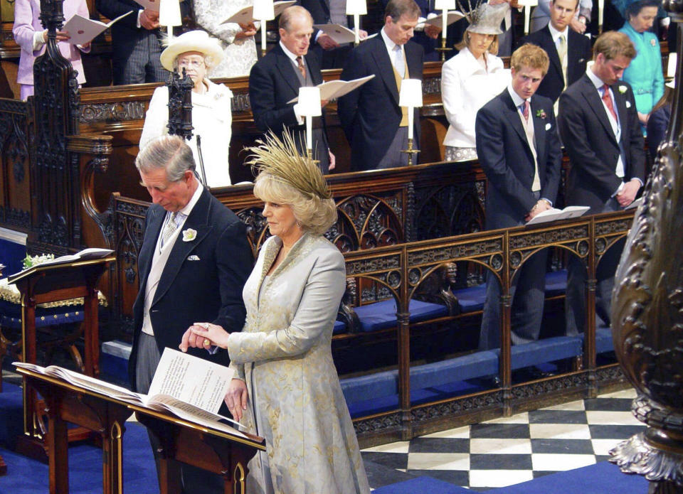 FILE - Britain's Prince Charles and his new wife, Camilla, the Duchess of Cornwall, with other members of the royal family during their wedding blessing at Windsor Castle's St George's Chapel, Windsor, England, on April, 9 2005. An explosive memoir reveals many facets of Prince Harry, from bereaved boy and troubled teen to wartime soldier and unhappy royal. From accounts of cocaine use and losing his virginity to raw family rifts, “Spare” exposes deeply personal details about Harry and the wider royal family. It is dominated by Harry's rivalry with brother Prince William and the death of the boys’ mother, Princess Diana in 1997. (Chris Young/Pool Photo via AP, File)