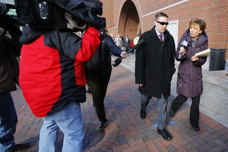 Transit police officer Richard Donahue (2nd R) is interviewed outside the federal courthouse following a pre-trial hearing for Boston Marathon bombing suspect Dzhokhar Tsarnaev in Boston, Massachusetts December 18, 2014. REUTERS/Brian Snyder