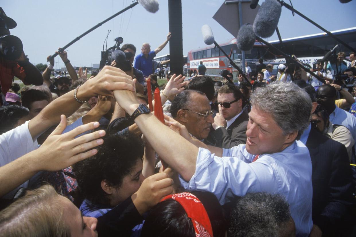 <span class="caption">Bill Clinton displaying how not to social distance while campaigning in 1992.</span> <span class="attribution"><a class="link " href="https://www.gettyimages.com/detail/news-photo/governor-bill-clinton-shakes-hands-at-an-unscheduled-bus-news-photo/144080085?adppopup=true" rel="nofollow noopener" target="_blank" data-ylk="slk:Joe Sohm/Visions of America/Universal Images Group via Getty Images;elm:context_link;itc:0;sec:content-canvas">Joe Sohm/Visions of America/Universal Images Group via Getty Images</a></span>