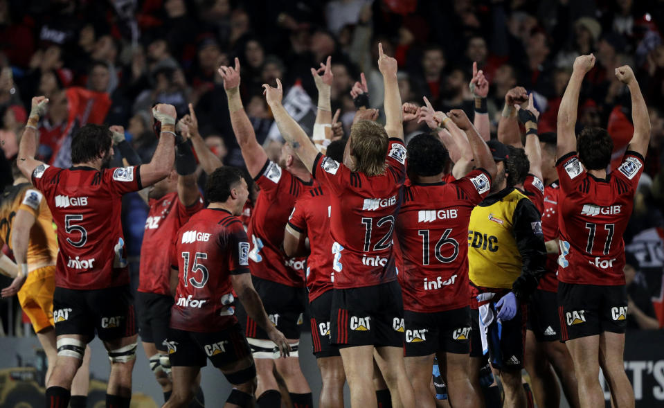 Crusaders players celebrate after defeating the Jaguars 19-3 to win the Super Rugby final in Christchurch, New Zealand, Saturday, July 6, 2019. (AP Photo/Mark Baker)