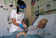 The Wider Image: The pandemic, a deadly cancer and my 14-year-old daughter