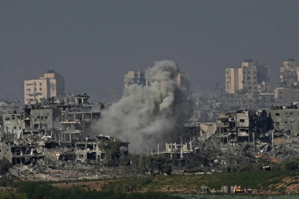 Smoke rises from a building following an Israeli airstrike in the Gaza Strip, as seen from southern Israel, Tuesday, Oct. 31, 2023.