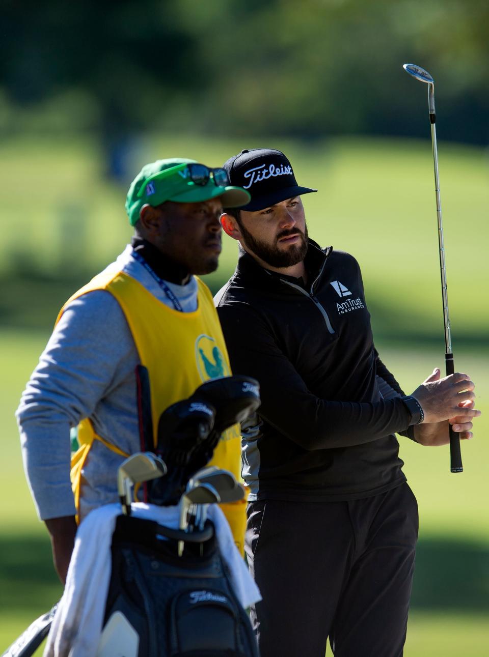 Hayden Buckley, right, of Tupleo, Miss., confers with his caddy before putting on the 9th in the first round of tournament play during the Sanderson Farms Championship at the Country Club of Jackson in Jackson, Miss., Thursday, Sept. 29, 2022.