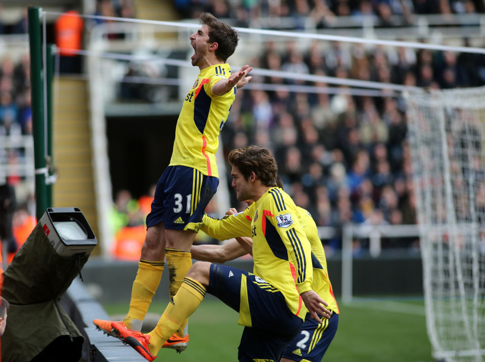 Sunderland's Fabio Borini, left, celebrates his goal during their English Premier League soccer match against Newcastle United at St James' Park, Newcastle, England, Saturday, Feb. 1, 2014. (AP Photo/Scott Heppell)