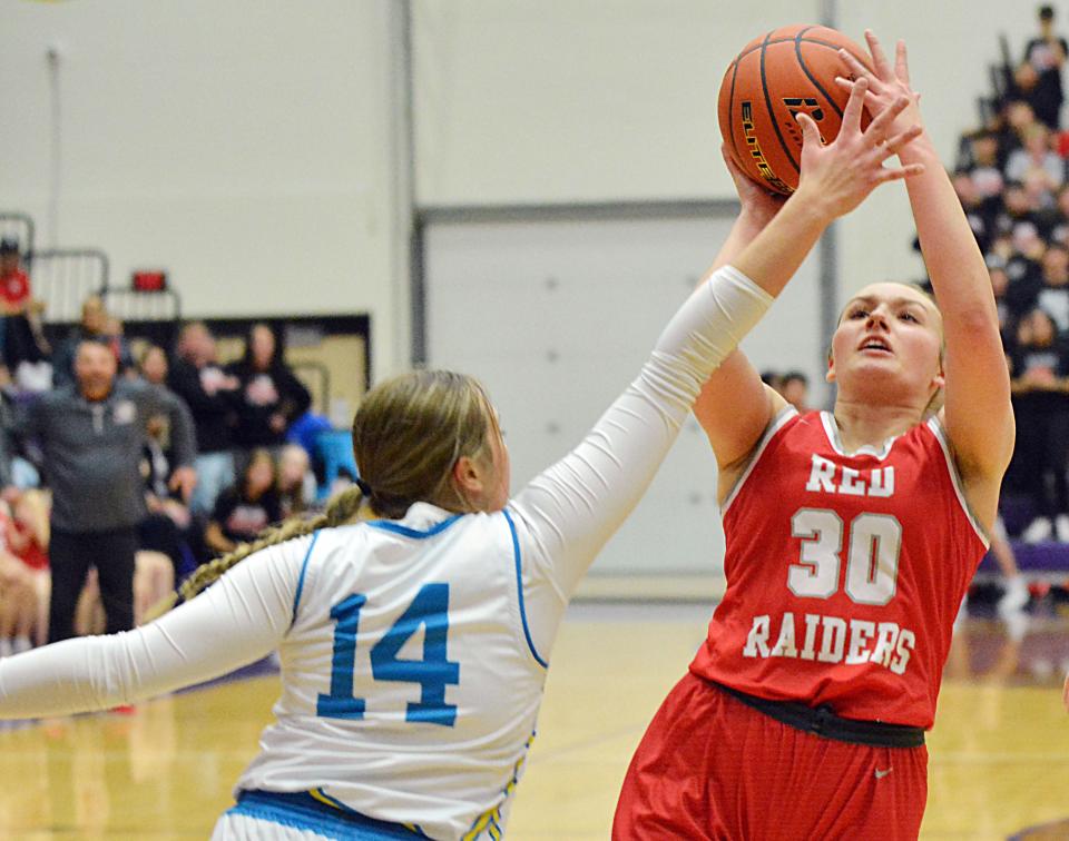 Wagner's Macy Koupal (30) puts up a shot against Hamlin's Ally Abraham during the championship game of the state Class A girls basketball tournament on Saturday, March 11, 2023 in the Watertown Civic Arena.