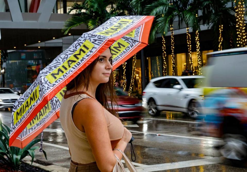 Lauren Rocchini, 29, of Brickell, waits to cross South Miami Avenue at 8th Street at Brickell City Centre in Miami on Wednesday, November 15, 2023.