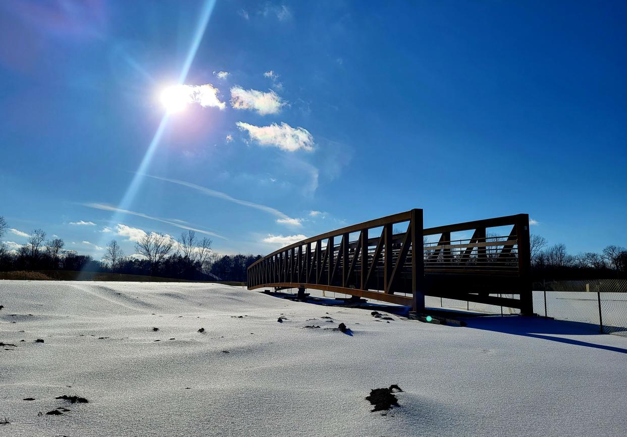 The bridge for a $1.4 million, 10-foot pathway over the Black River Canal awaits on the waterway's north side on Tuesday, Feb. 28, 2023, in Port Huron. A massive joint venture, the bridge adds to the Bridge-to-Bay trail.