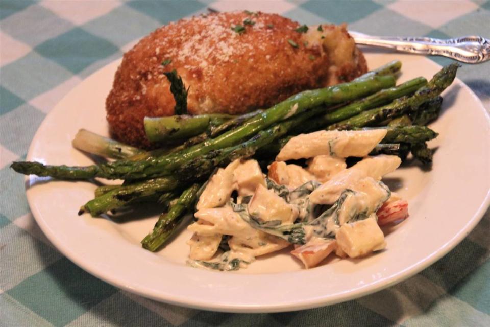 Chicken cordon bleu, asparagus and pasta salad are an example of the selections at the grab-and-go section of Rouses Market.