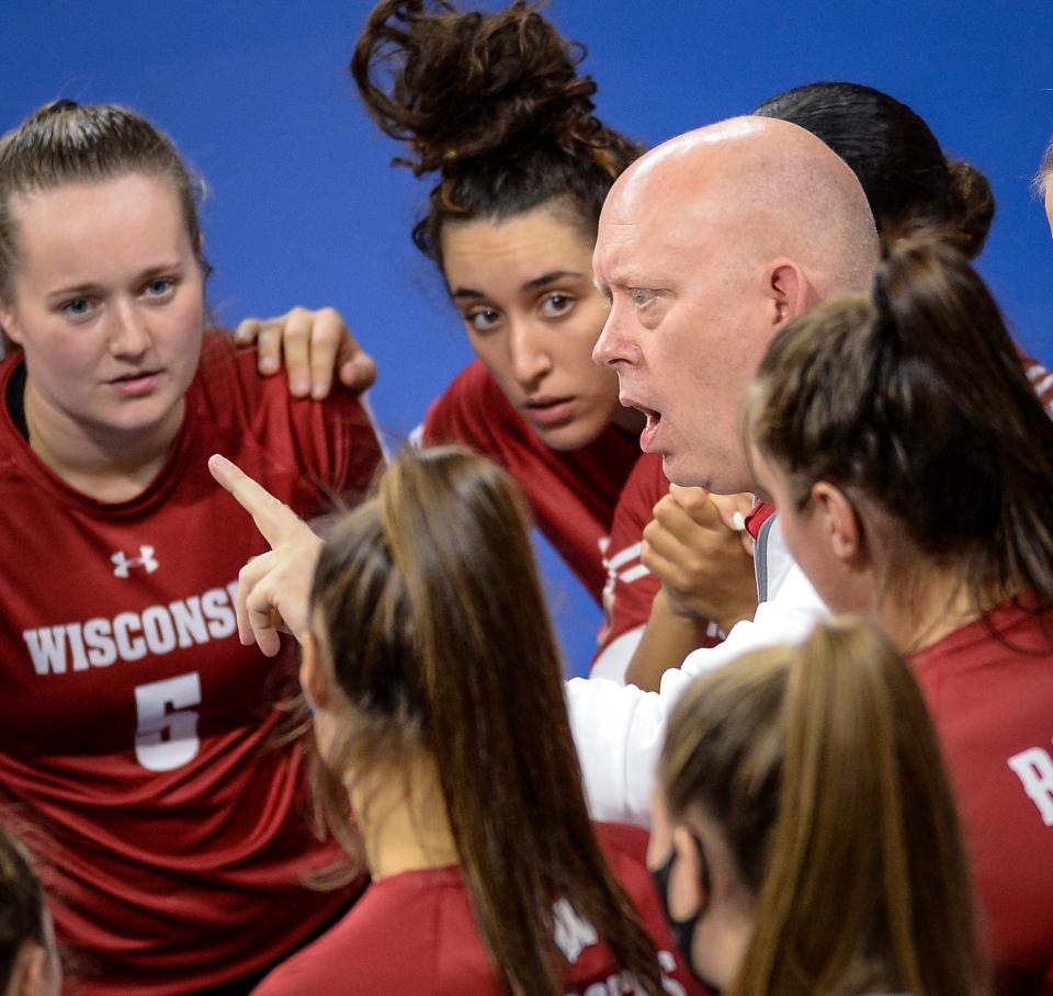 Wisconsin volleyball coach Kelly Sheffield talks to his players during a break in a match against Marquette in September.