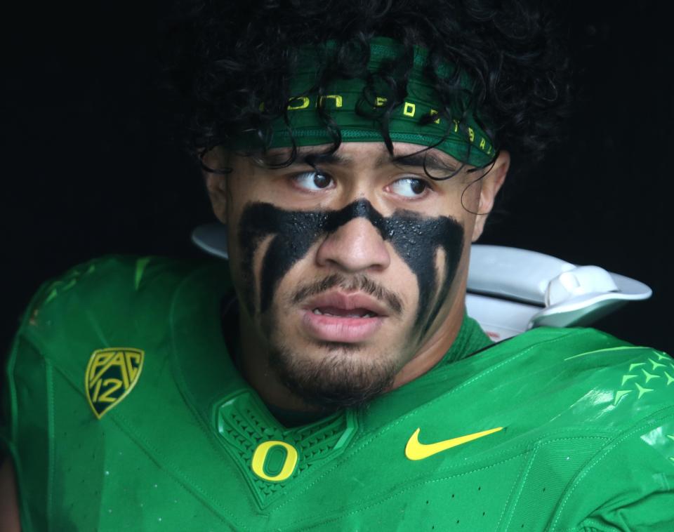 Oregon's Noah Sewell watches senior introductions from the tunnel before the final regular season game against Oregon State.