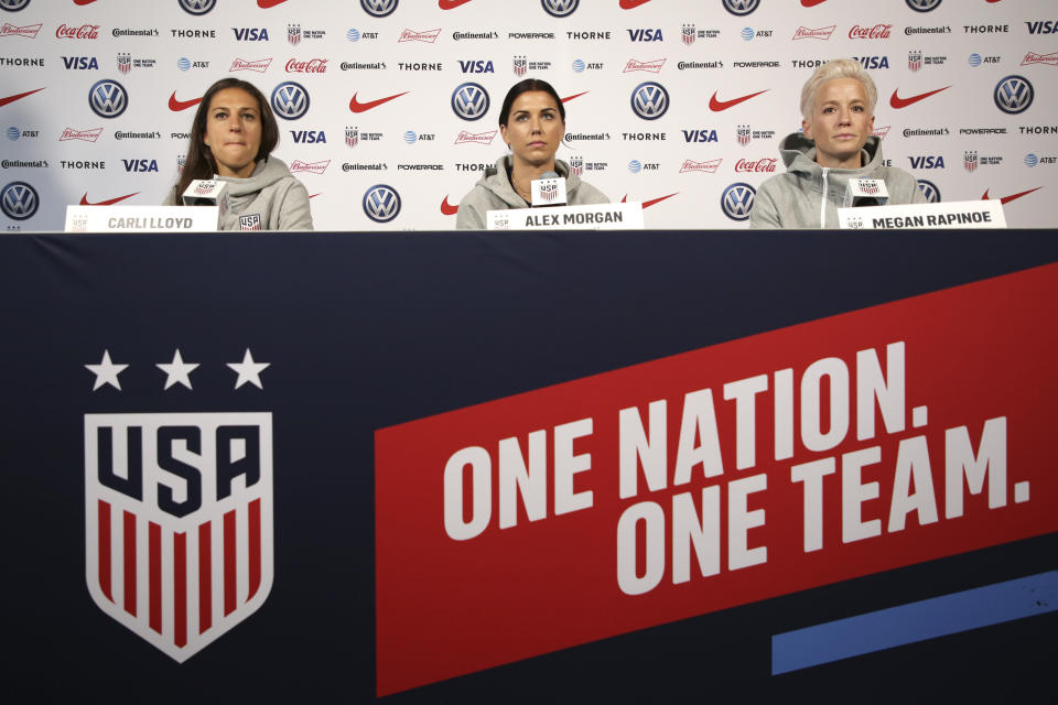 United States women's national soccer team members, from left, Carli Lloyd, Alex Morgan and Megan Rapinoe speak to reporters during a news conference in New York, Friday, May 24, 2019. (AP Photo/Seth Wenig)