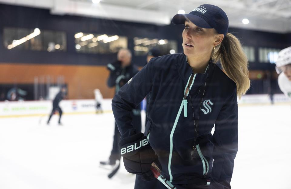 Jessica Campbell runs a drill during a Seattle Kraken rookie development camp on Tuesday, July 2, 2024, in Seattle. Campbell will become the first woman to work on the bench of an NHL franchise after the Seattle Kraken hired her as an assistant coach Wednesday, July 3, 2024. (Nick Wagner/The Seattle Times via AP)