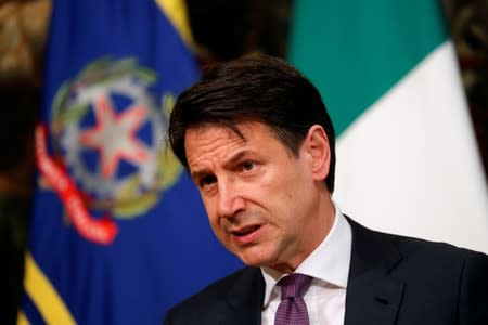 Italian Prime Minister Giuseppe Conte looks on as he holds a news conference at Chigi Palace in Rome