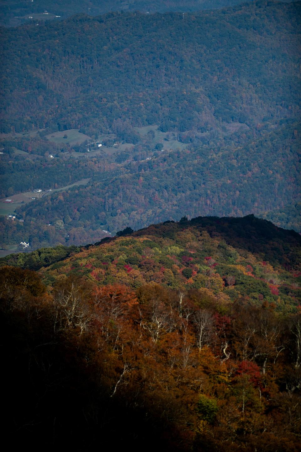 Fall color is seen below Craggy Gardens on the Blue Ridge Parkway, October 19, 2023.