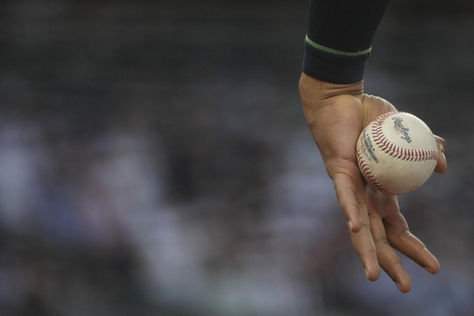 New York Yankees' Juan Soto holds a baseball during the third inning of the team's baseball game against the Baltimore Orioles, Tuesday, June 18, 2024, in New York. (AP Photo/Pamela Smith)