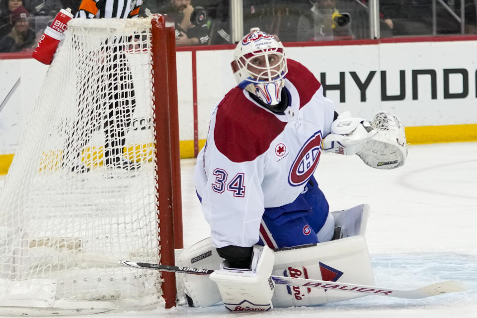 Montreal Canadiens goaltender Jake Allen makes the save against the New Jersey Devils during the second period of an NHL hockey game, Saturday, Feb. 24, 2024, in Newark, N.J. (AP Photo/Mary Altaffer)