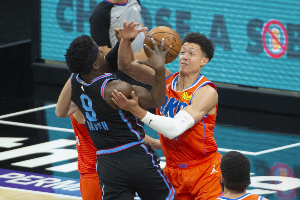 Sacramento Kings guard Terence Davis (9) is fouled by Oklahoma City Thunder center Isaiah Roby during the first quarter of an NBA basketball game in Sacramento, Calif., Tuesday, May 11, 2021. (AP Photo/Randall Benton)