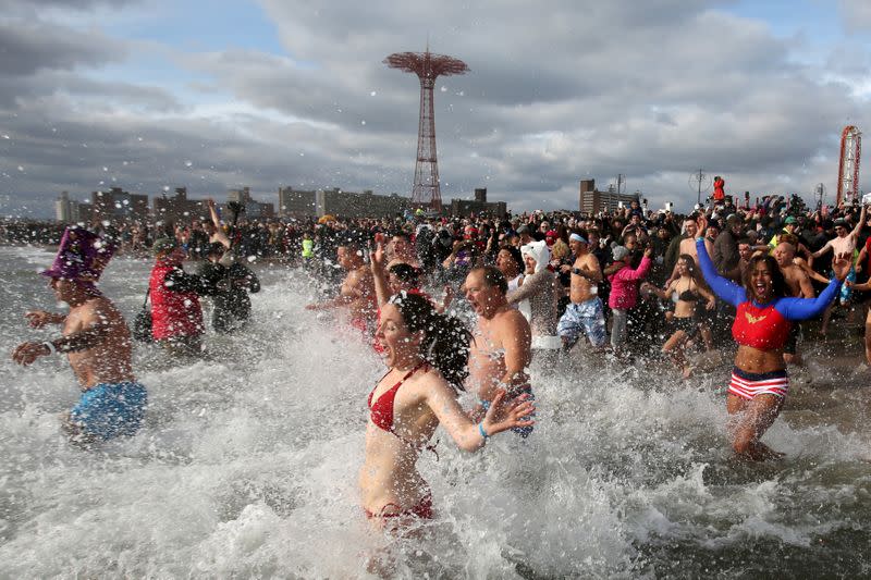 FILE PHOTO: Participants enter the water during the Coney Island Polar Bear Club's annual New Year's Day swim at Coney Island in the Brooklyn borough of New York.