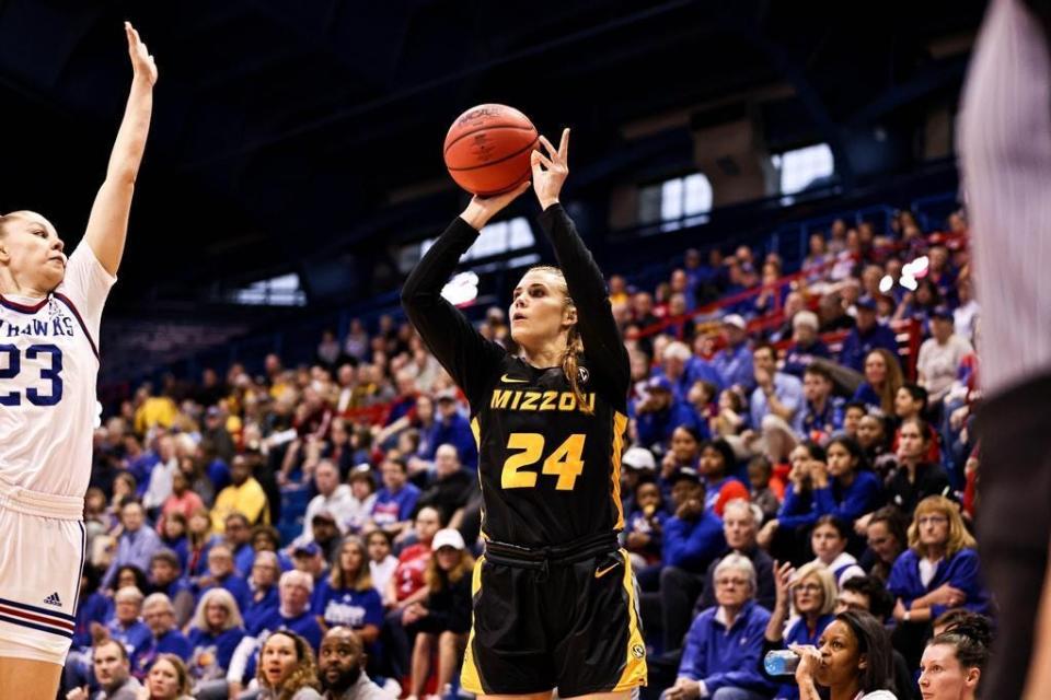 Missouri guard Ashton Judd (24) fires a 3-point shot against the Kansas Jayhawks during the 2023 WNIT on March 20, 2023, in Lawrence, Kan.