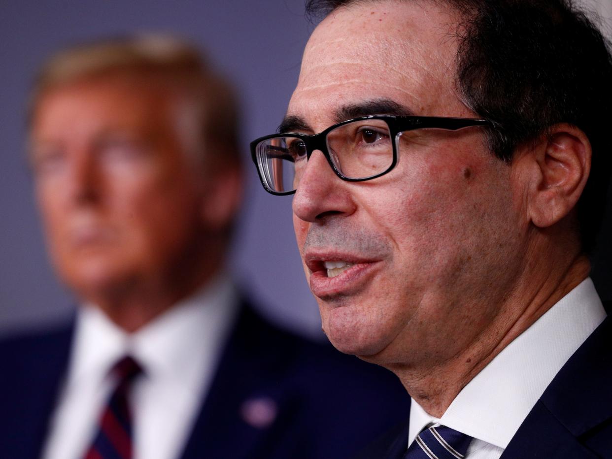 FILE PHOTO: Treasury Secretary Steven Mnuchin addresses the daily coronavirus response briefing as U.S. President Donald Trump listens at the White House in Washington, U.S., April 2, 2020. REUTERS/Tom Brenner