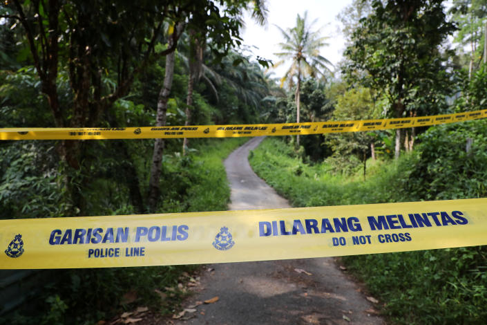 A police line is seen at an entrance to the Dusun Resort, where 15-year-old Irish girl Nora Anne Quoirin went missing in Seremban, Malaysia, August 13, 2019. REUTERS/Lim Huey Teng