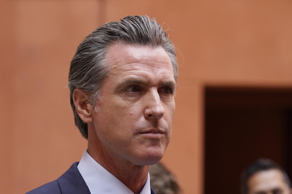 California Gov. Gavin Newson listens to a question while meeting with reporters after casting his recall ballot at a voting center in Sacramento, Calif., Friday, Sept. 10, 2021. The last day to vote in the recall election is Tuesday Sept. 14. A majority of voters must mark "no" on the recall to keep Newsom in office. (AP Photo/Rich Pedroncelli)