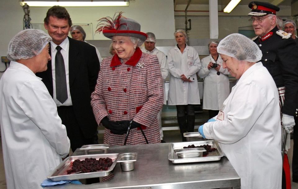 <p>It wouldn't be Christmas without some pudding. The Queen, dressed in a festive coat, visits the Wilkin & Sons factory and tours the Christmas pudding packing area. Later, she debuted a commemorative plaque marking the day.</p>